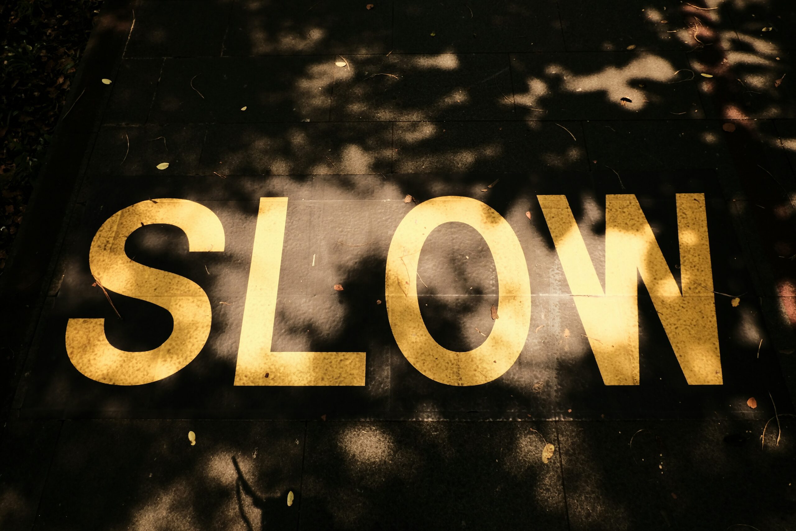 slow sign on road